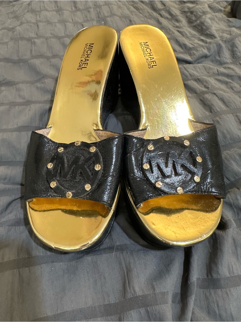 Michael Kors Black Leather Slide Mules with Gold Footbed and Stud Detail